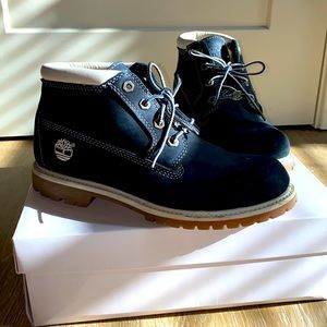 Black and cream suede Timberland boots.